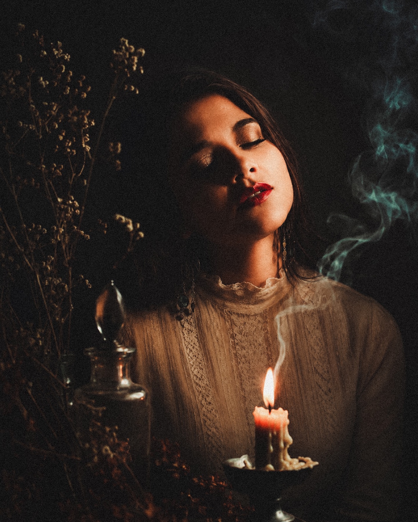 Laura in a candlelit ritual space